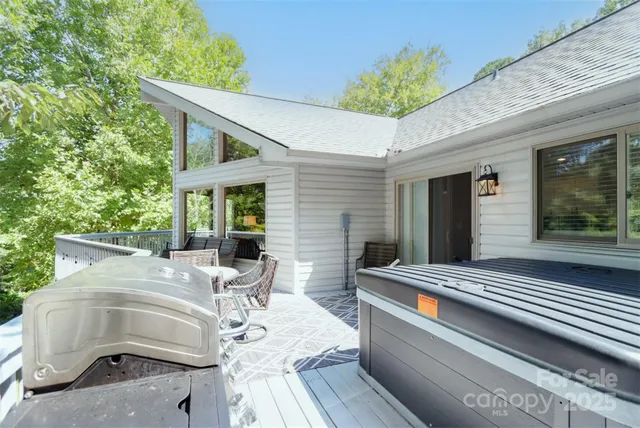 a view of house with backyard and outdoor seating