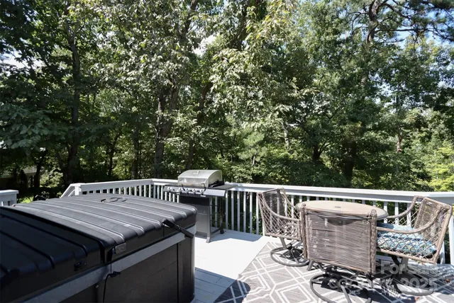 a view of a chairs and table on the deck