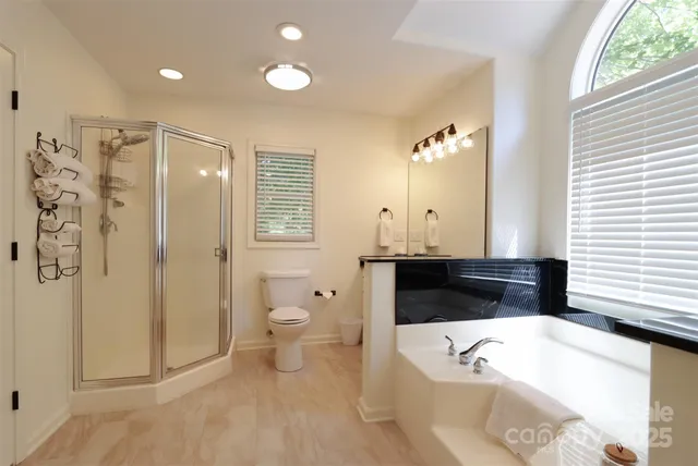 a bathroom with a bathtub sink and toilet