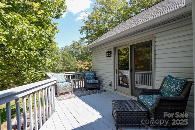 a view of a two chairs in the deck