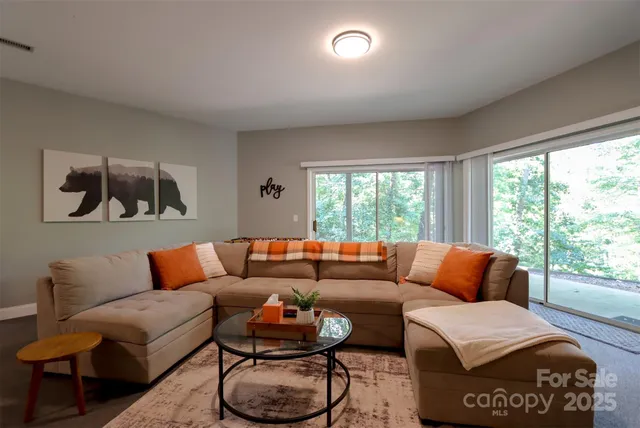 a living room with furniture and a large window