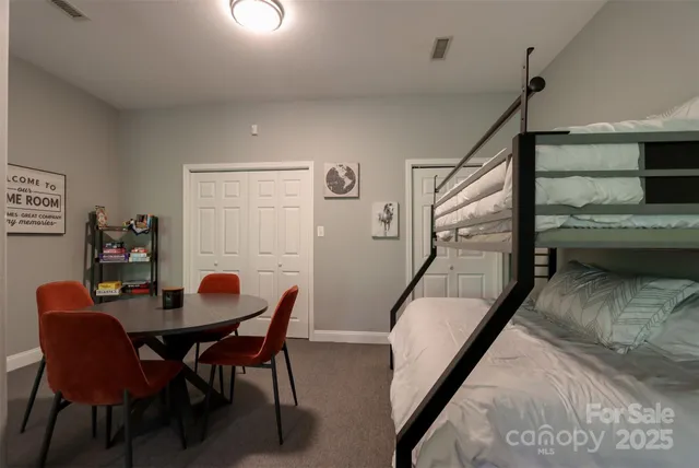 a view of a dining room with furniture and a potted plant