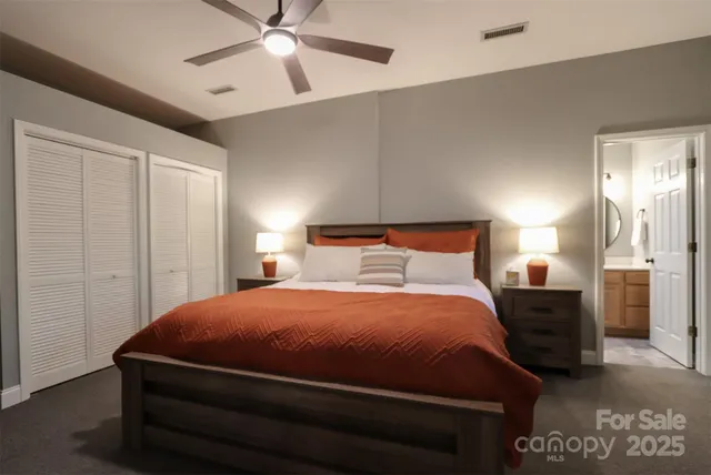 a bedroom with a bed and cabinet