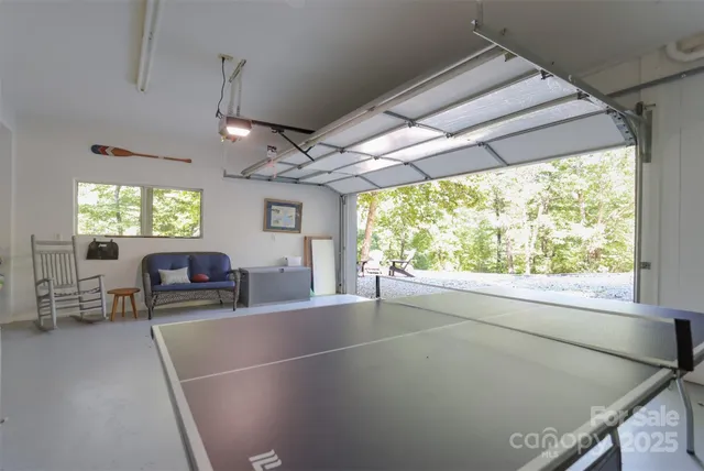 a view of a livingroom with furniture and a window