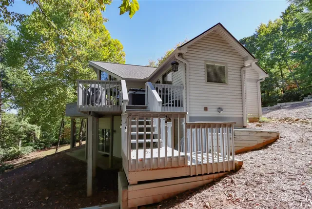a view of a house with wooden deck