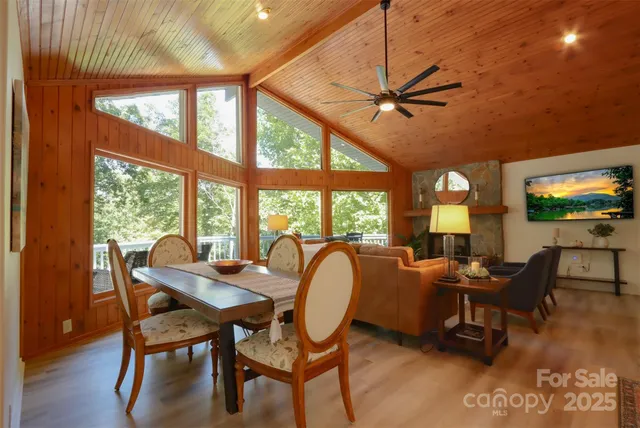 a dining room with furniture water view and a flat screen tv