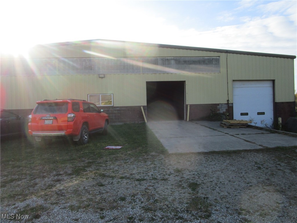 4267 Austin Road Geneva, OH 44041 - Photo 36 of 42 Front view of building with man door, overhead door and loading dock