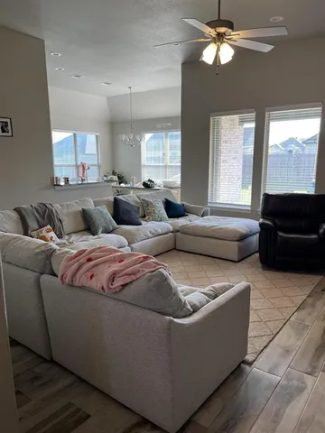 a living room with furniture and a window