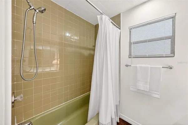 a bathroom with a sink toilet and mirror
