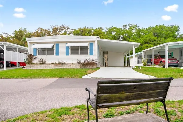 a view of a swimming pool with a table and chairs