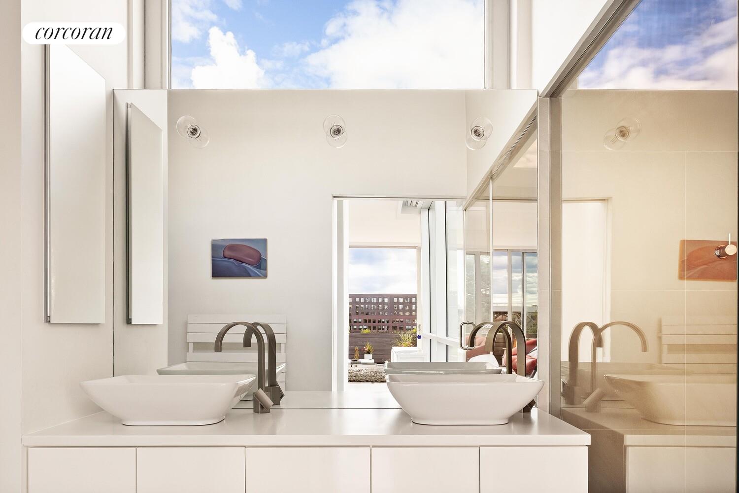 47 4th Street Brooklyn, NY 11231 - Photo 22 of 28 a bathroom with a sink and a large mirror