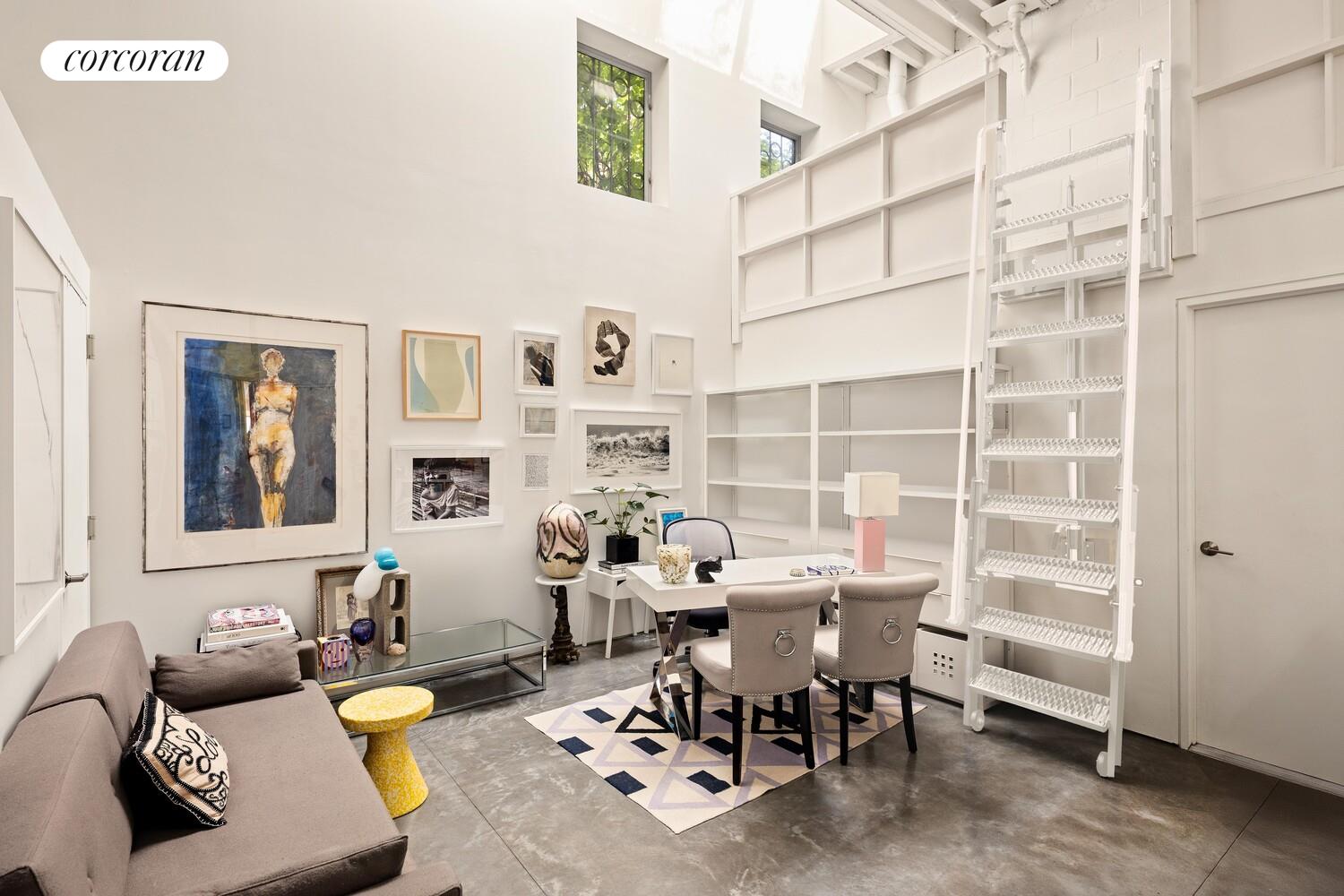 47 4th Street Brooklyn, NY 11231 - Photo 24 of 28 a living room with furniture a rug and white walls