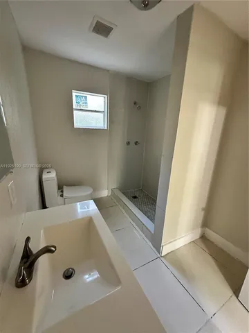 a bathroom with a tub and a shower