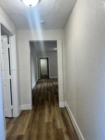 a view of a livingroom with wooden floor