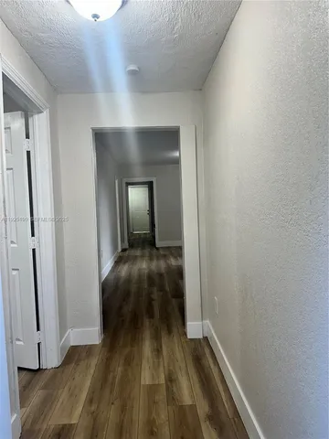 a view of a livingroom with wooden floor