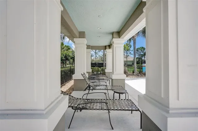 a kitchen with a refrigerator a stove a sink dishwasher and white cabinets with wooden floor