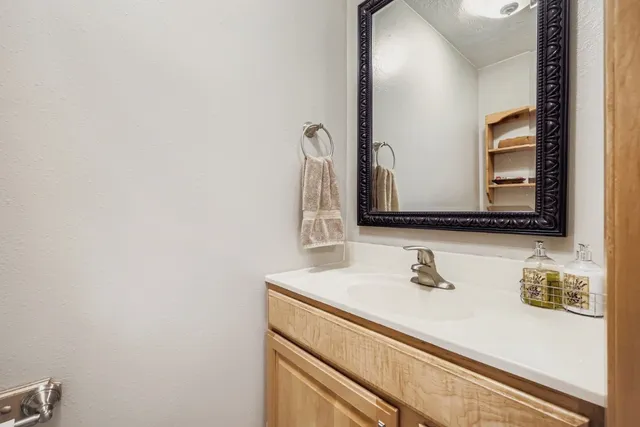 a bathroom with a sink and a mirror