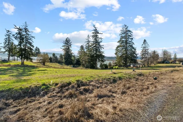 a view of a lake with a big yard