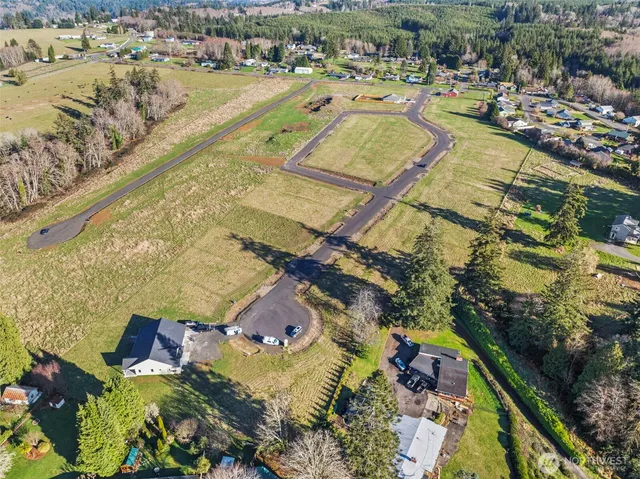 a view of a swimming pool with a yard