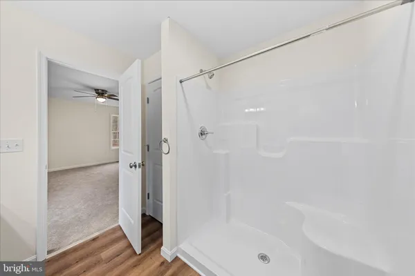 a bathroom with a bathtub and a shower