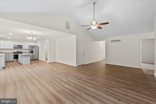 a view of a room with a kitchen