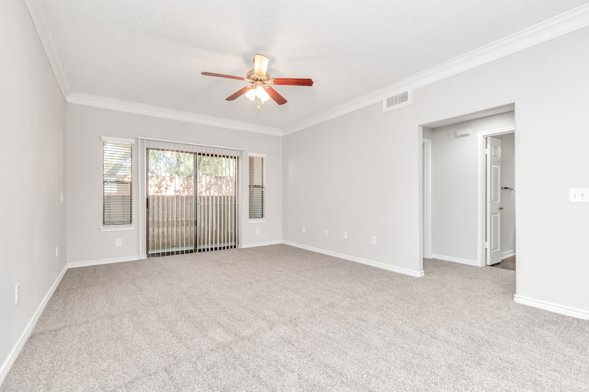 1600 Eldridge Parkway South, Unit 3205 Houston, TX 77077 - Photo 15 of 38 a view of an empty room with chandelier fan and fire place
