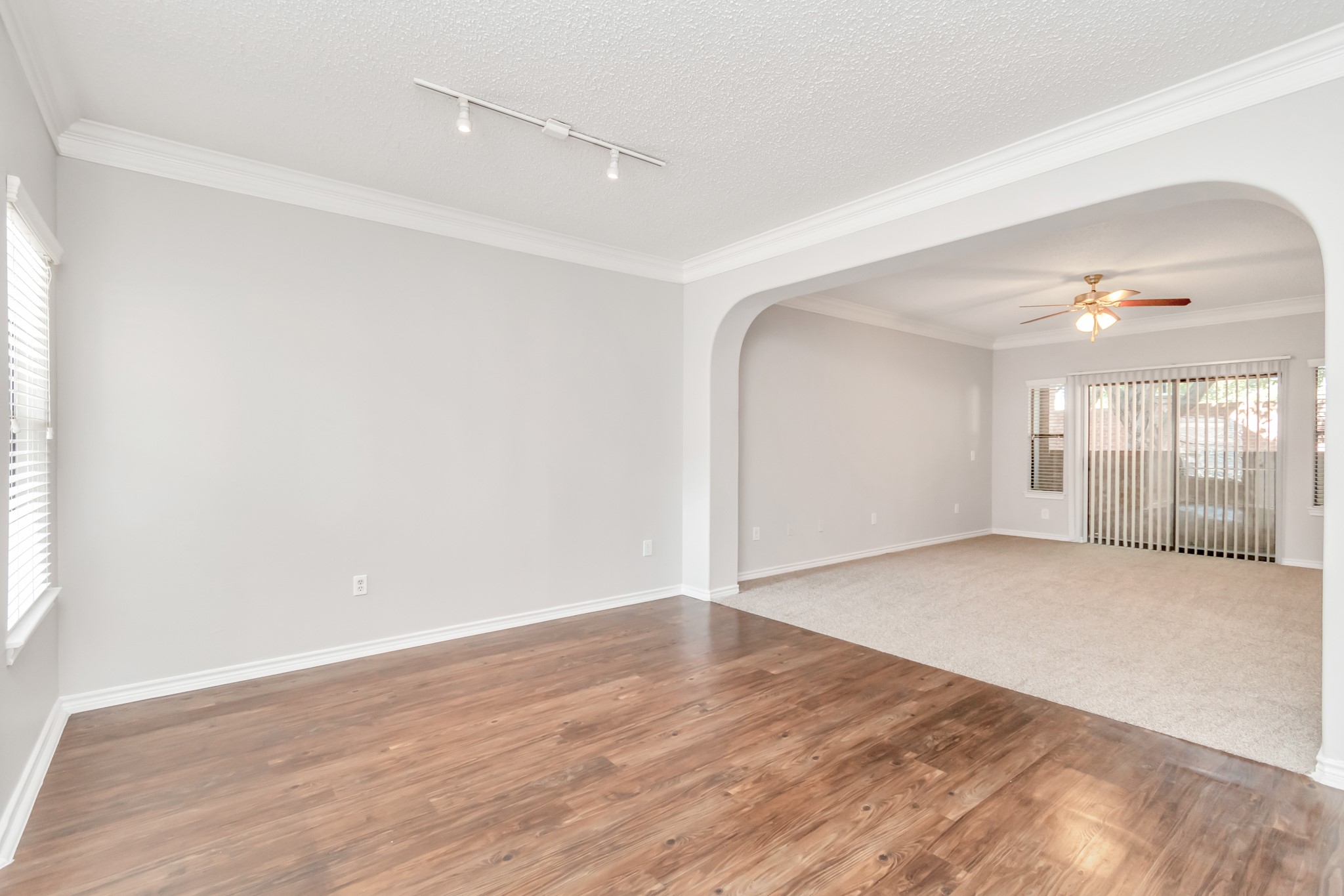 1600 Eldridge Parkway South, Unit 3205 Houston, TX 77077 - Photo 6 of 38 an empty room with wooden floor and windows