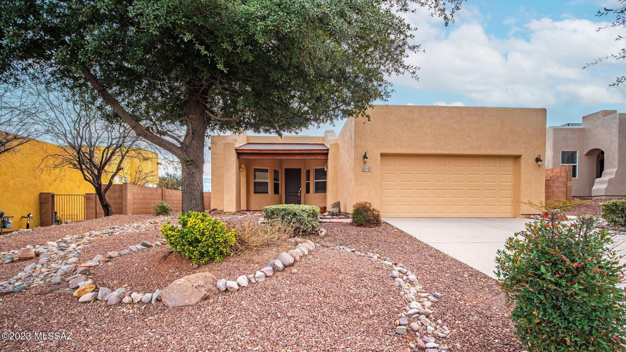 300 Circulo Bellagio Rio Rico, AZ 85648 - Photo 1 of 27 a front view of a house with a yard and garage