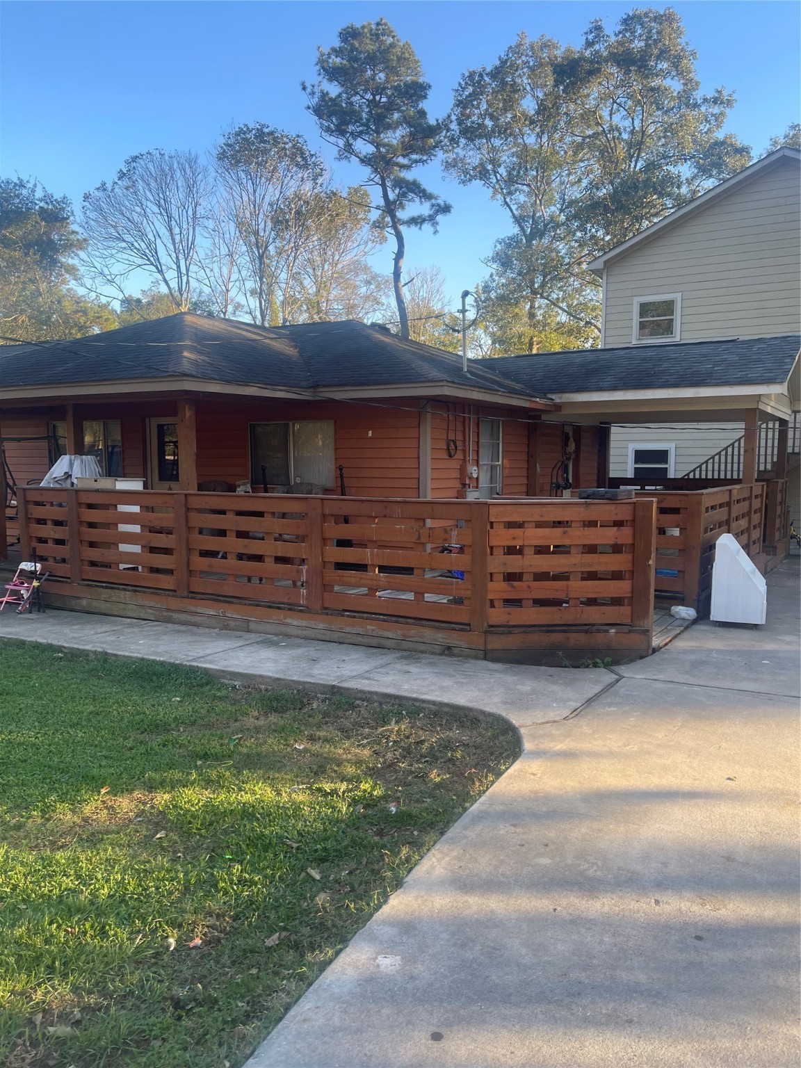 397 County Road 379 Cleveland, TX 77328 - Photo 1 of 15 a front view of a house with garden
