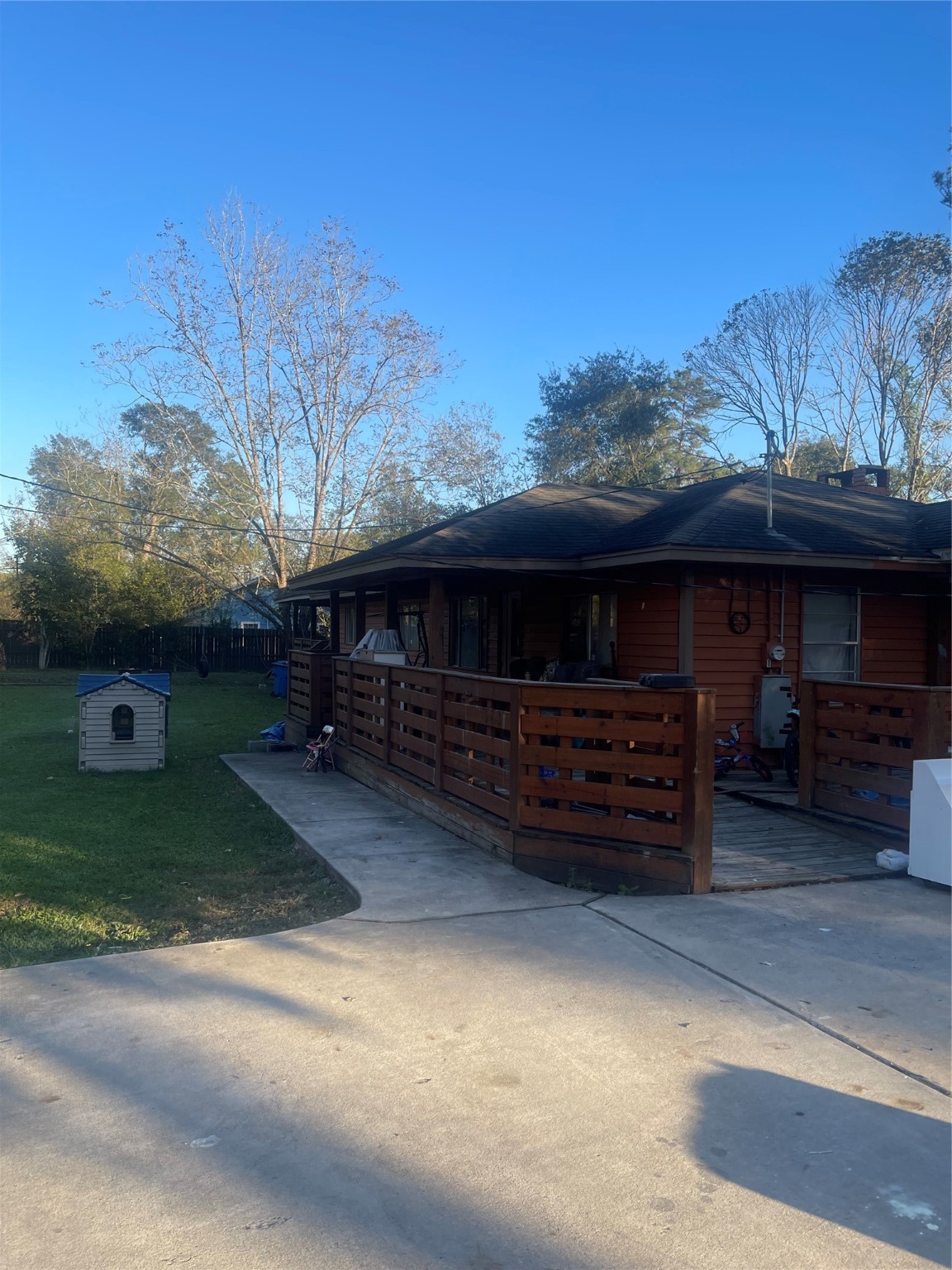 397 County Road 379 Cleveland, TX 77328 - Photo 5 of 15 a view of house with outdoor space