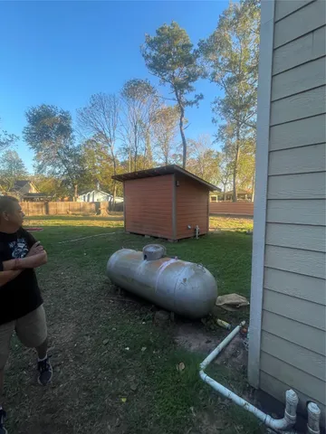 a view of a backyard with hardwood