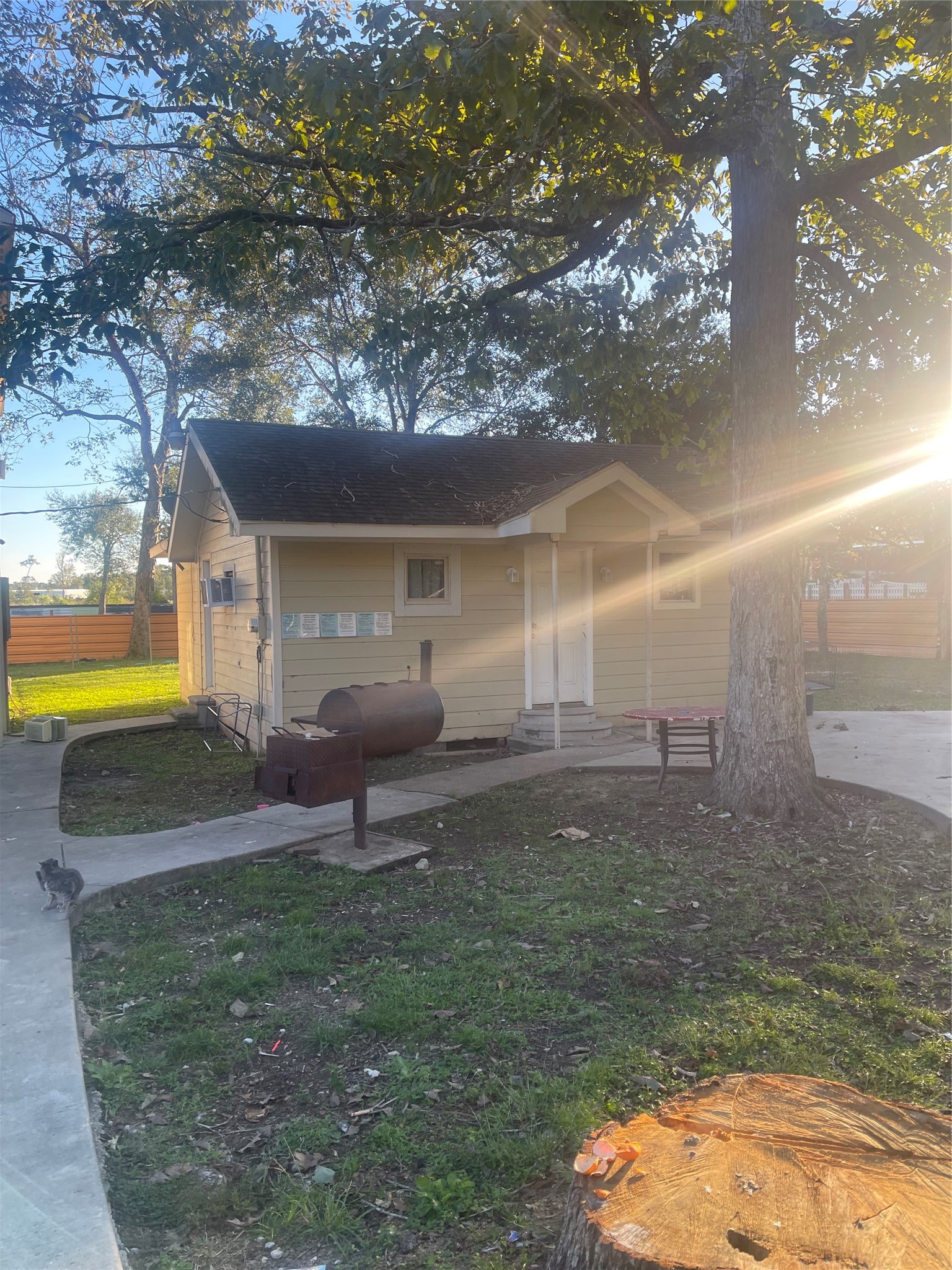 397 County Road 379 Cleveland, TX 77328 - Photo 10 of 15 a backyard of a house with yard and outdoor seating