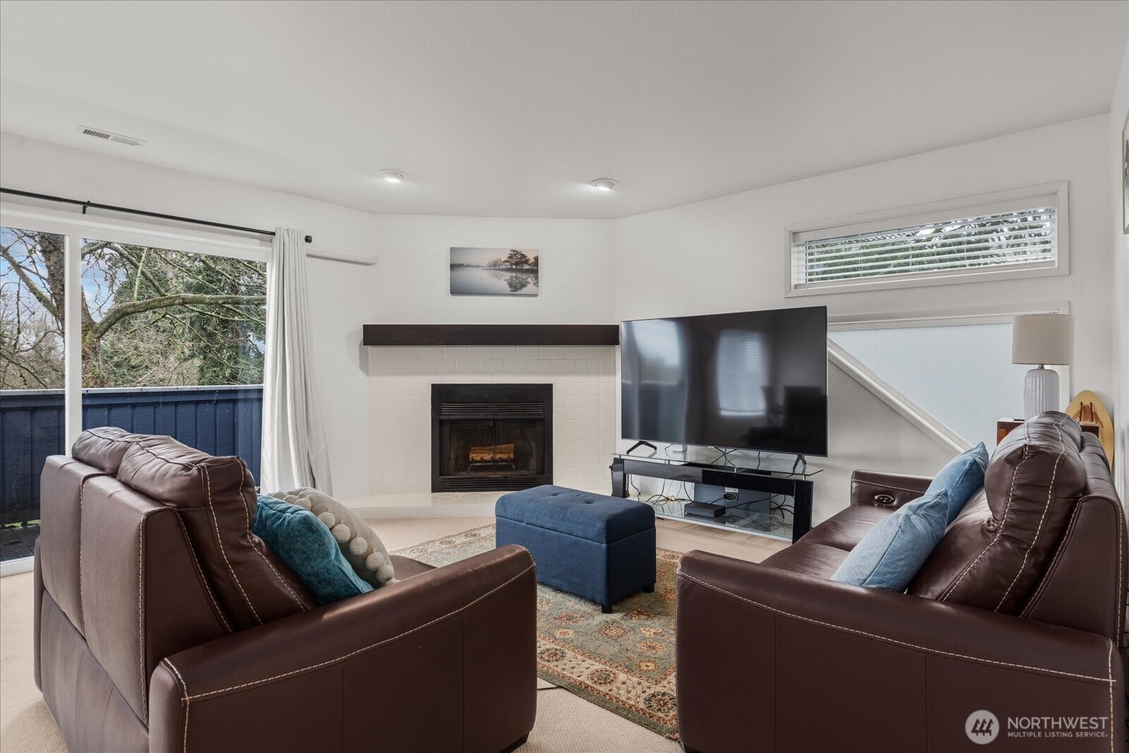 4120 212th Street Southwest, Unit B206 Mountlake Terrace, WA 98043 - Photo 7 of 20 a living room with furniture and a flat screen tv