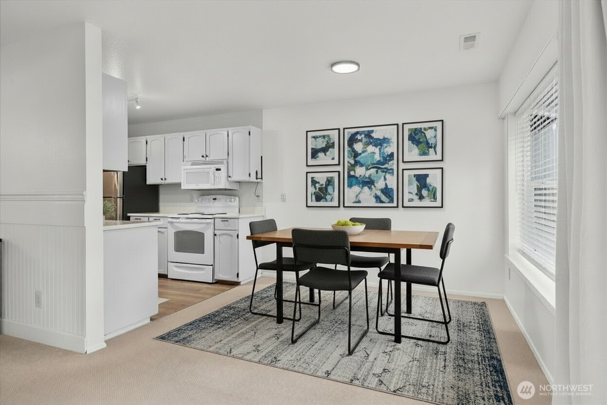 4120 212th Street Southwest, Unit B206 Mountlake Terrace, WA 98043 - Photo 8 of 20 a view of a dining room with furniture and window