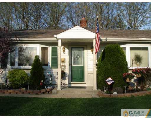 29 Cambridge Road Edison, NJ 08817 - Photo 1 of 10 a front view of a house with garden