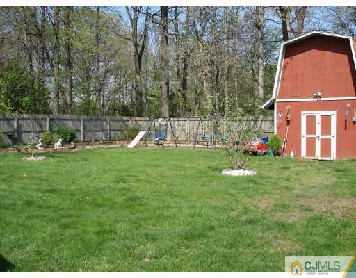 29 Cambridge Road Edison, NJ 08817 - Photo 7 of 10 a view of a house with a backyard and sitting area