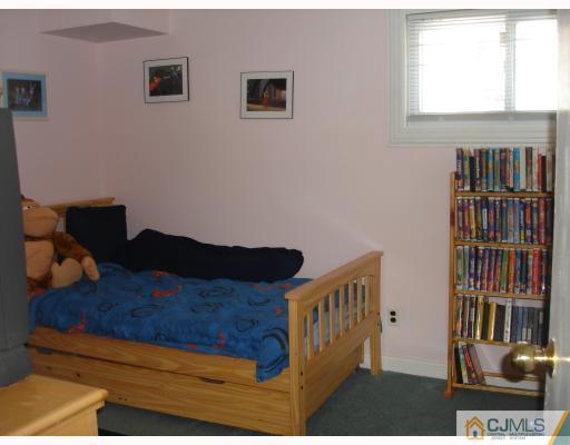 29 Cambridge Road Edison, NJ 08817 - Photo 9 of 10 a view of bedroom with furniture and staircase