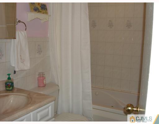 29 Cambridge Road Edison, NJ 08817 - Photo 10 of 10 a bathroom with a sink and a shower