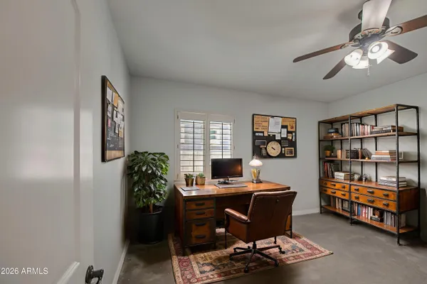 a workspace with furniture and window