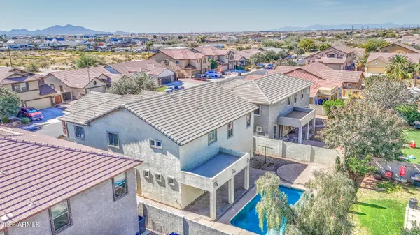 an aerial view of a house with a ocean view