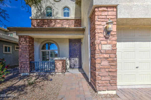 a view of front door of house with stairs