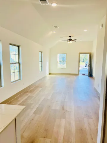 a view of an empty room with a window