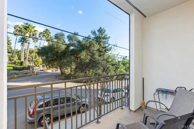 a view of a balcony with chair and table