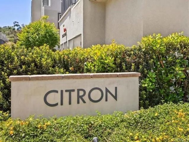 a street sign that is on a wooden wall