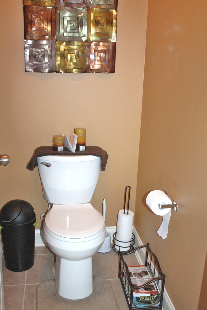 26 Riverside Landing Fort Mitchell, AL 36856 - Photo 45 of 65 a white toilet sitting next to a bathroom sink