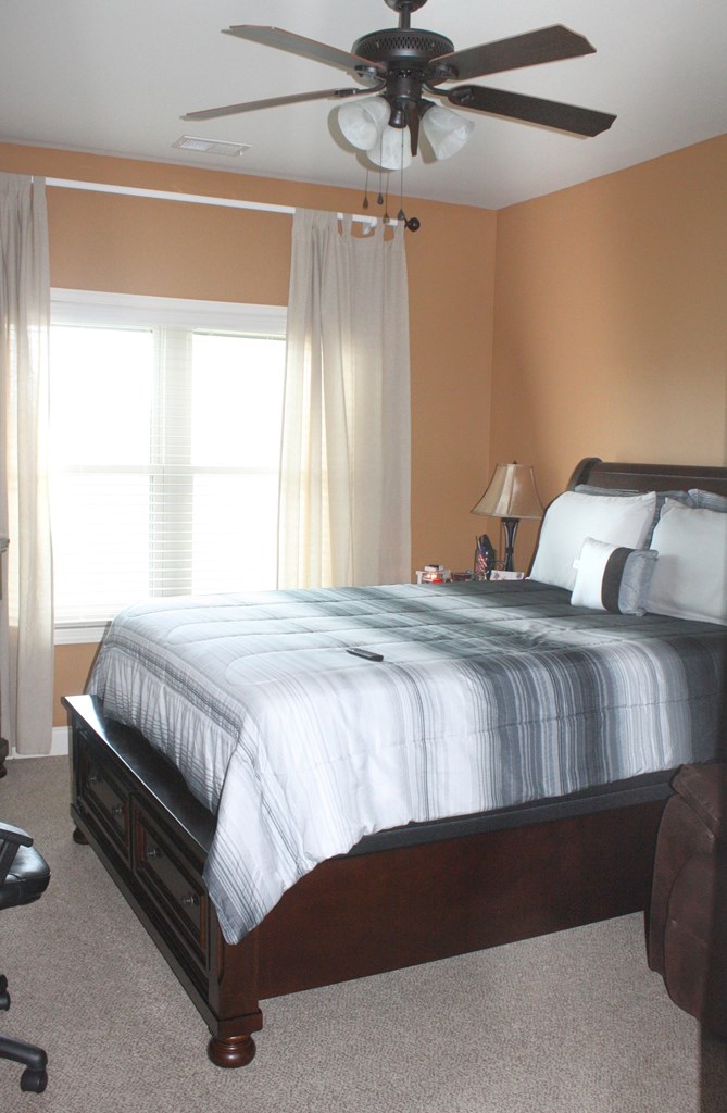 26 Riverside Landing Fort Mitchell, AL 36856 - Photo 49 of 65 a bedroom with a bed next to a window