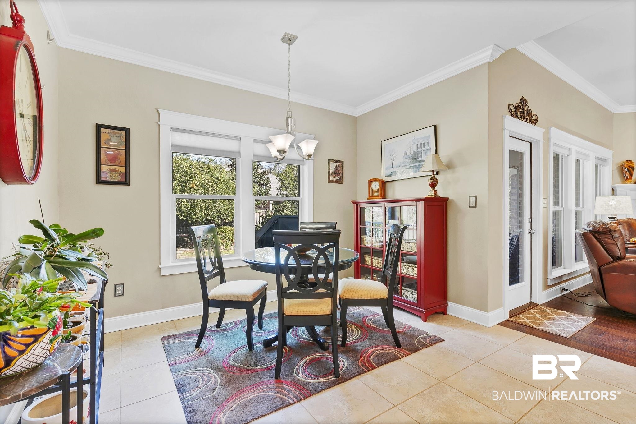 20105 Bunker Loop Fairhope, AL 36532 - Photo 25 of 65 Dining space featuring light tile patterned floors, baseboards, and ornamental molding