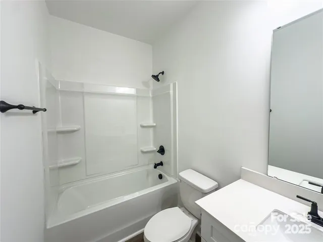 a bathroom with a toilet sink and bathtub