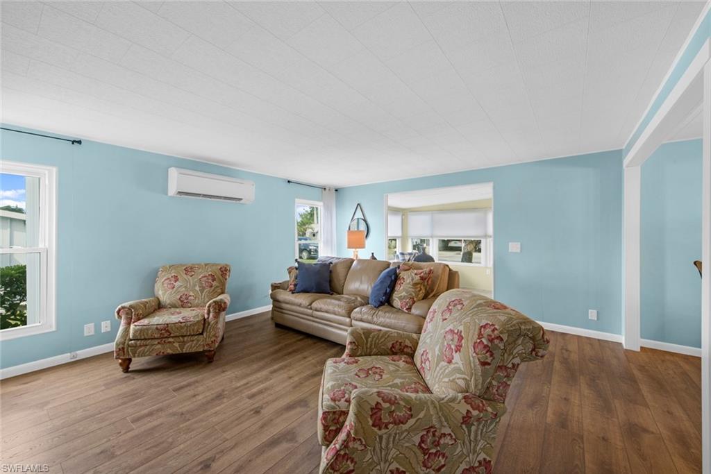 28 Enchanting Boulevard, Unit E28 Naples, FL 34112 - Photo 12 of 28 a living room with furniture