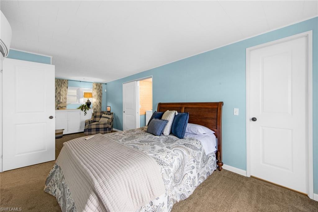 28 Enchanting Boulevard, Unit E28 Naples, FL 34112 - Photo 15 of 28 a bedroom with bed and window